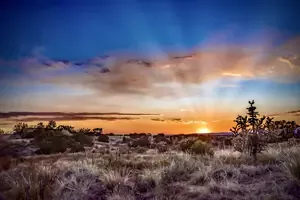 Sunrise over the Sangre de Cristo Mountains accentuates Taos as a healing sanctuary.