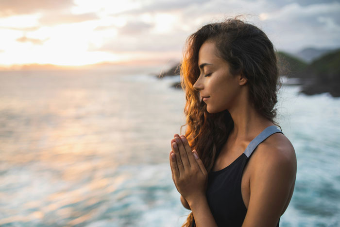 Young woman gives micro-gratitudes fro the beauty she sees in Nature.