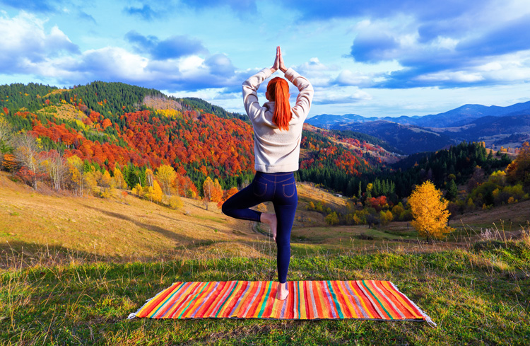 Young woman doing yoga to enhance the spiritual experiences of Taos. Young woman doing yoga to enhance the spiritual experiences of Taos.