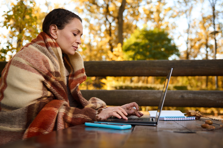 Beautiful young content creator working in early morning at Grand Teton National Park. Beautiful young content creator working in early morning at Grand Teton National Park.