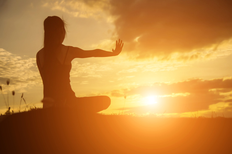Young woman experiencing a spiritual awakening in the mountains above Taos New Mexico.