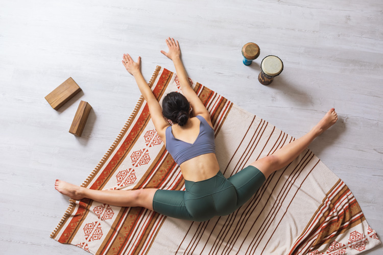 Young woman using yoga to connect to Taos as a healing sanctuary.