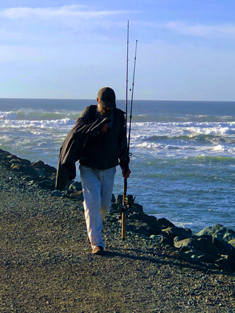 An older fisherman on the jetty at Barview Jetty Park.