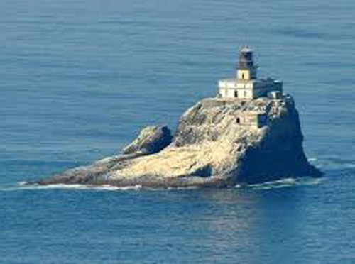 The iconic Tillamook Rock Lighthouse, seen from the western edge of Ecola State Park.