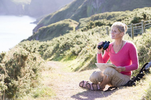 using binoculars to view Tillamook Rock Lighthouse at Ecola State Park makes studying it much more comfortable.