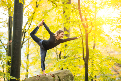 Some women athletes like to do Yoga poses on big logs and rocks in Ecola State Park.