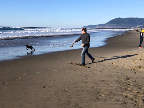 Dog owners are prevalent during Thanksgiving Day on Rockaway Beach.