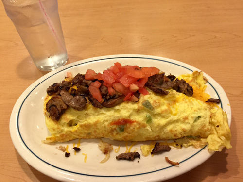 This huge Denver Omelet was one of the dumbest things I have ever eaten. It was way to much for me.