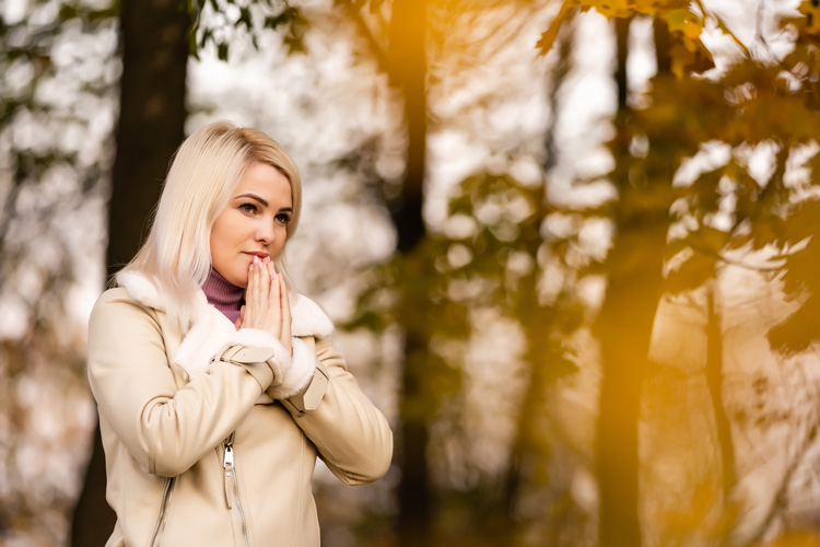 Young woman thankful to experience the spiritual vibe of Taos among the iconic aspen trees.